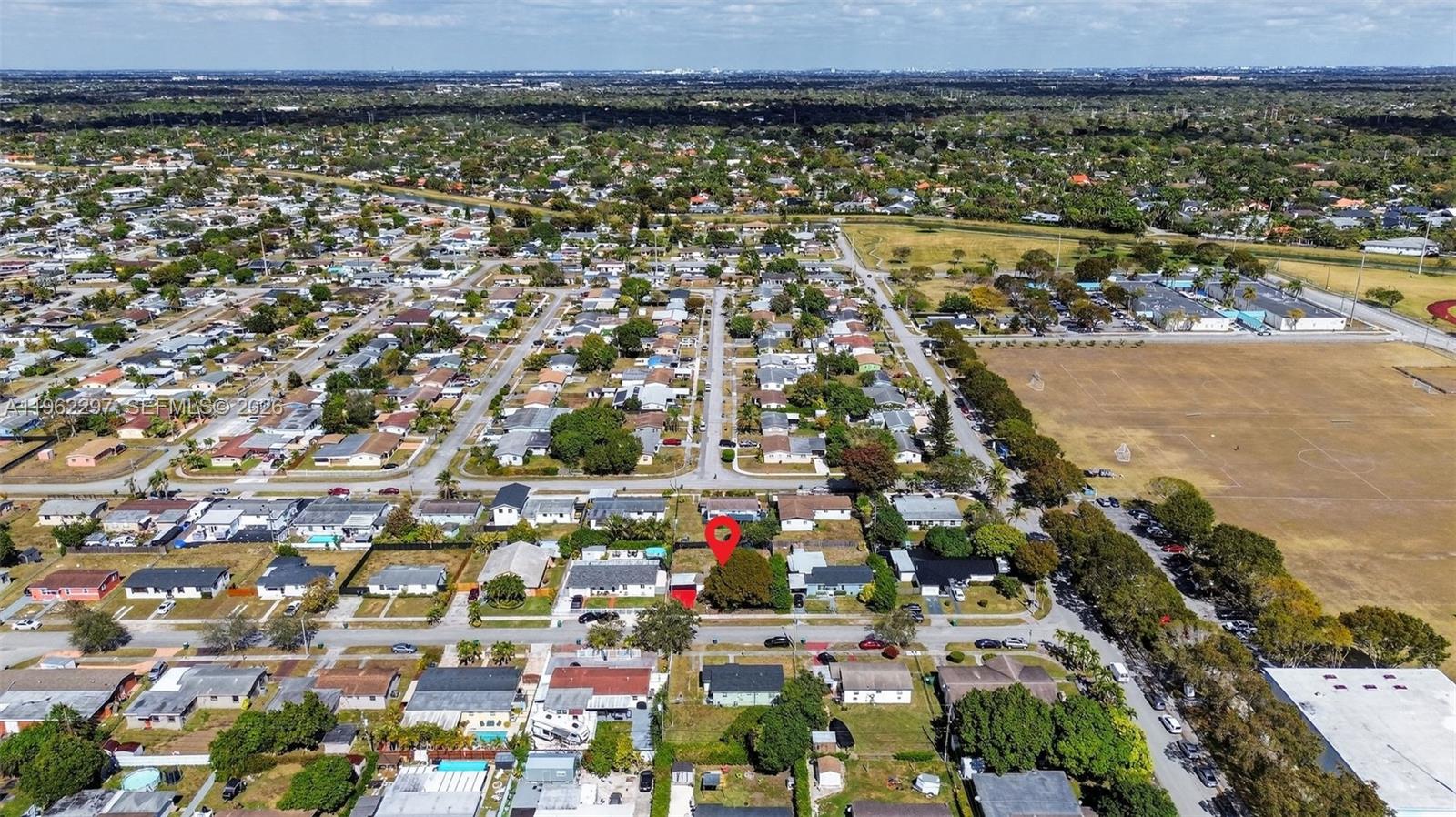 10325 Southwest 149th Terrace Miami, FL 33176 - Photo 22 of 34 an aerial view of residential building and lake