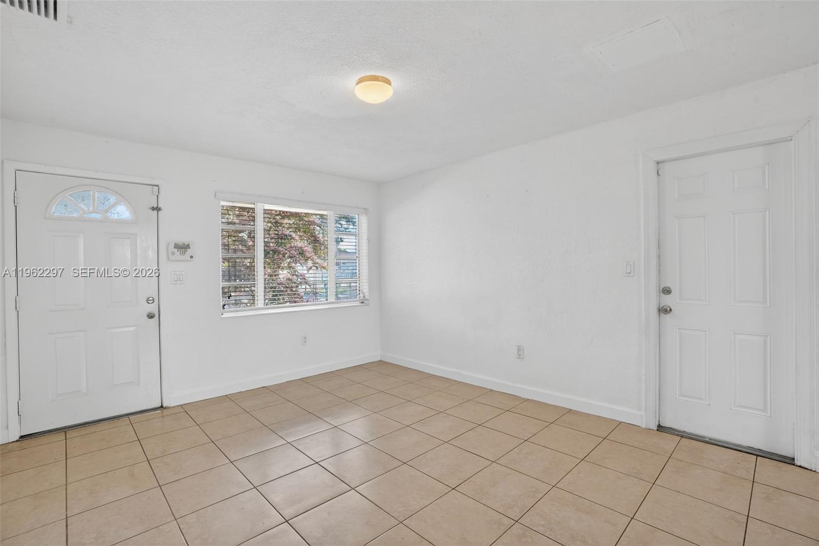 10325 Southwest 149th Terrace Miami, FL 33176 - Photo 26 of 34 a view of an empty room and window