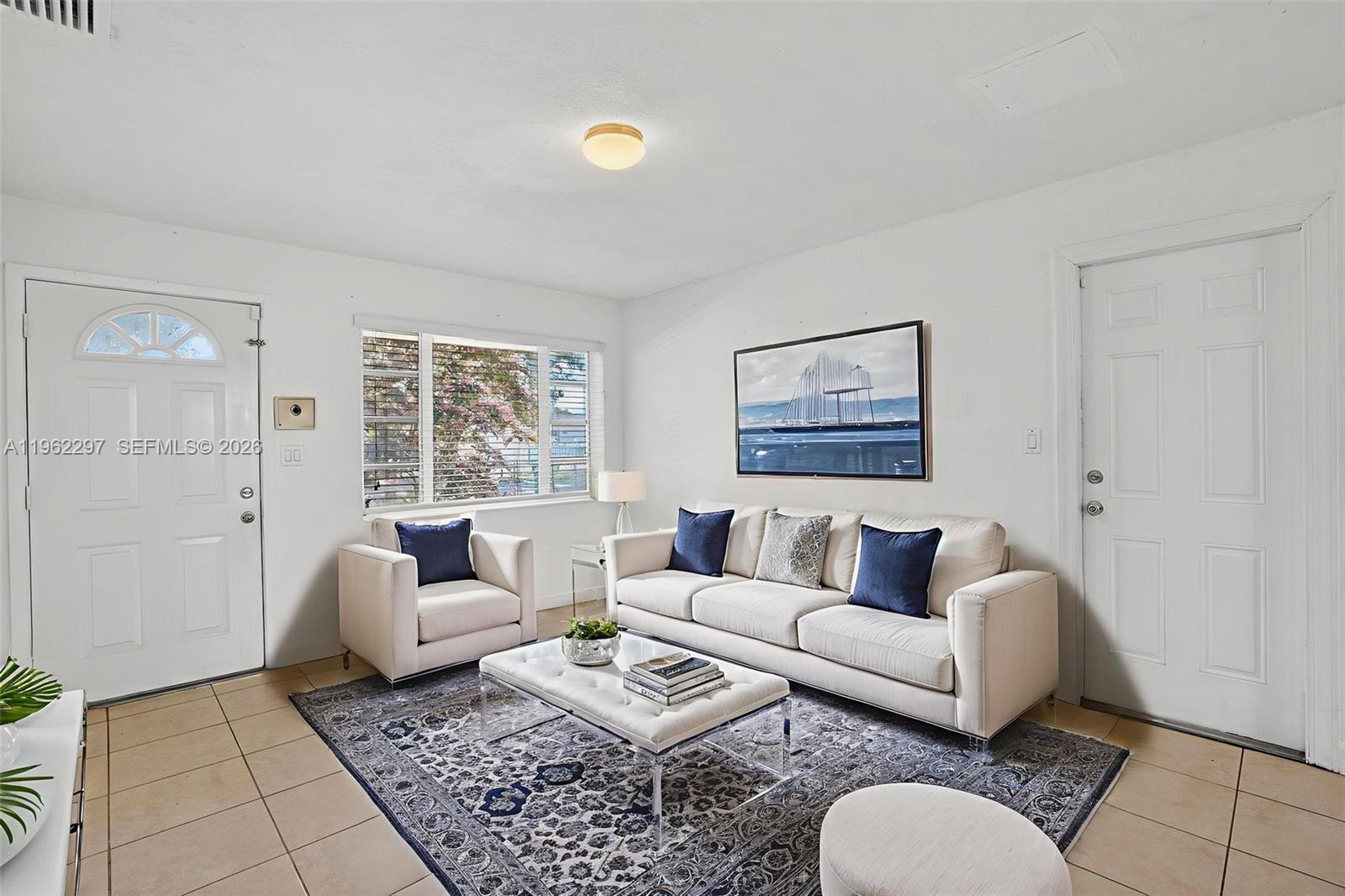 10325 Southwest 149th Terrace Miami, FL 33176 - Photo 27 of 34 a living room with furniture and a rug