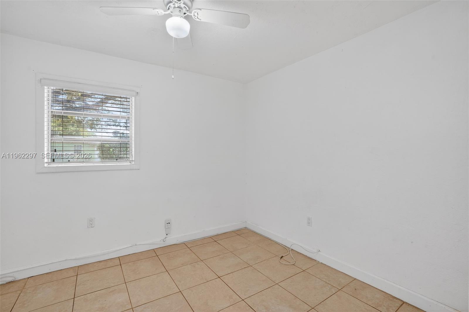 10325 Southwest 149th Terrace Miami, FL 33176 - Photo 33 of 34 an empty room with a window