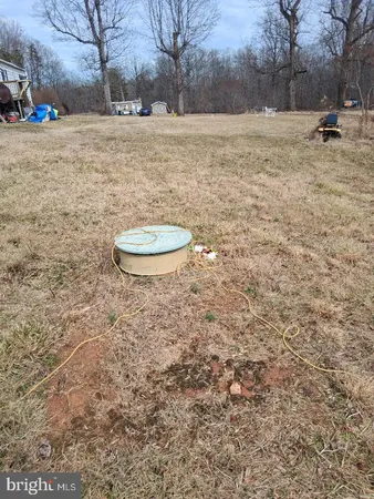 a backyard of a house with barbeque oven