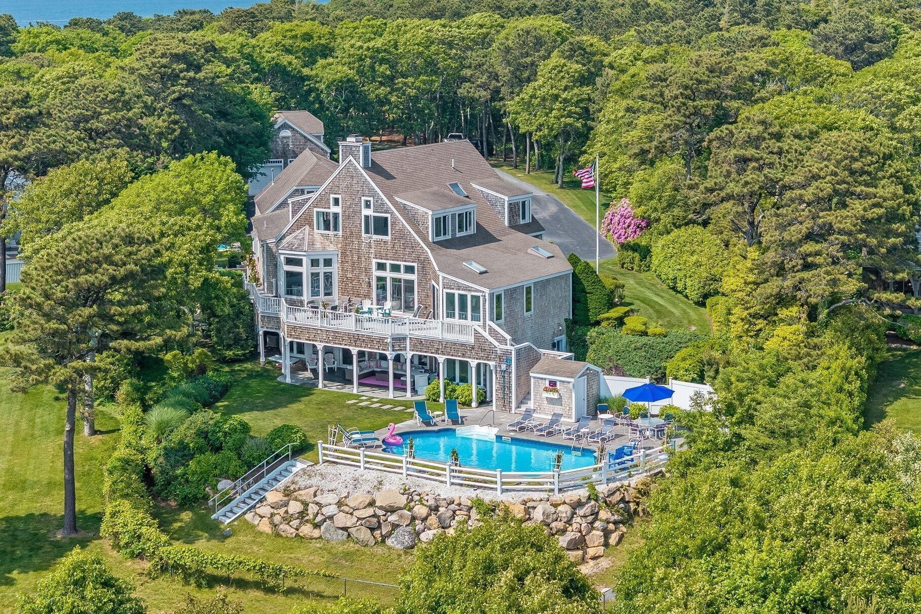 461 Wings Neck Road Pocasset, MA 02559 - Photo 9 of 42 an aerial view of a house with a garden and plants