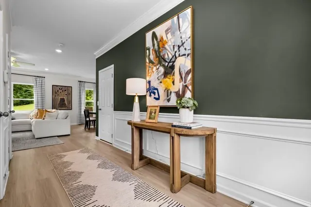 a living room with furniture and lamp