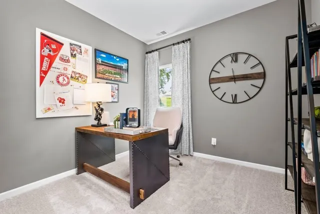 a view of a workspace with furniture