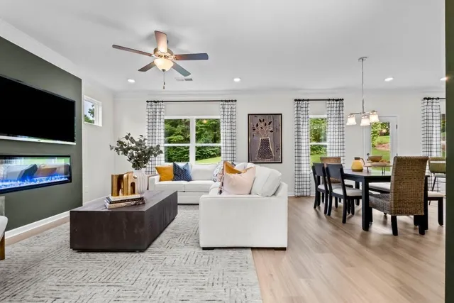 a living room with furniture fireplace and a flat screen tv