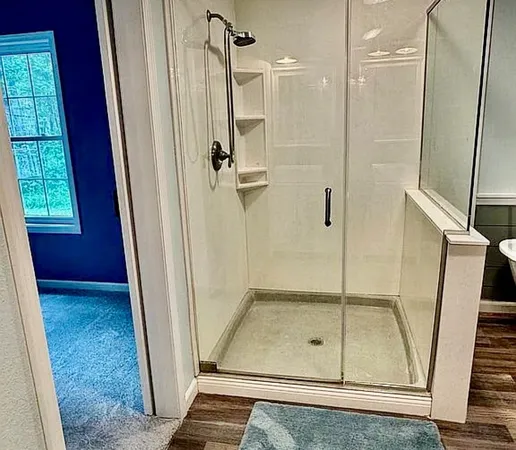 a white bath tub sitting next to a white sink