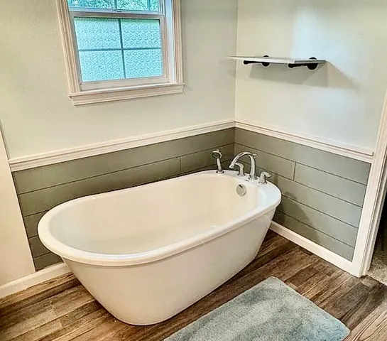 a bathroom with a sink toilet and mirror