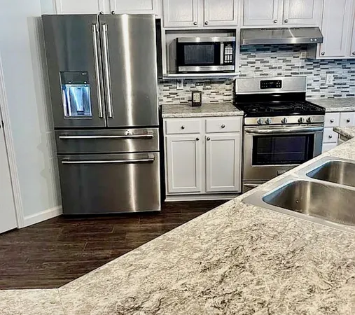 a room with a sink and a mirror