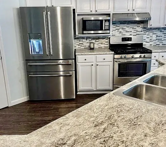 a room with a sink and a mirror