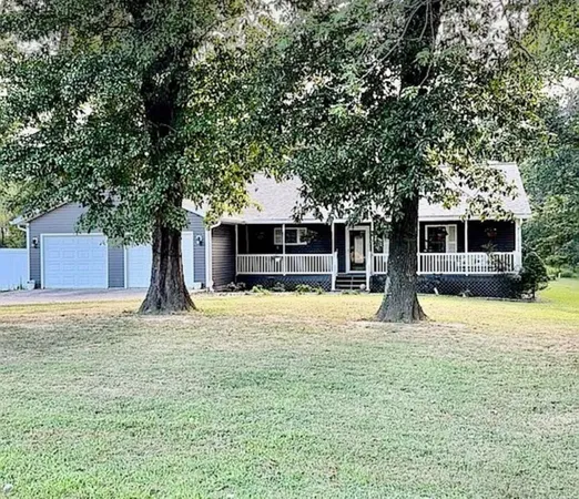 a house with trees in the background