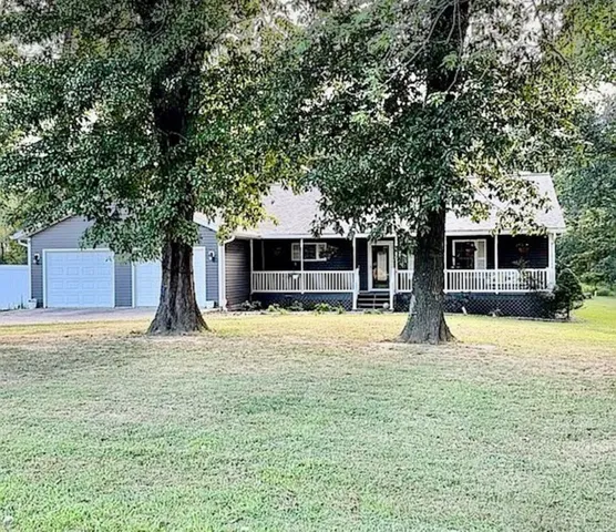 a house with trees in the background