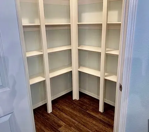 a view of an empty room with a fan