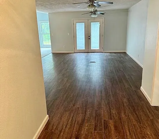 a kitchen with a sink a stove and cabinets