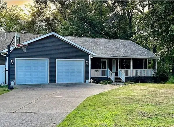 a front view of house with yard outdoor seating and barbeque oven