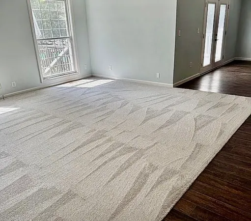 a kitchen with granite countertop stainless steel appliances a refrigerator and cabinets