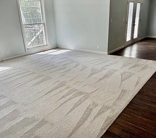 a kitchen with granite countertop stainless steel appliances a refrigerator and cabinets