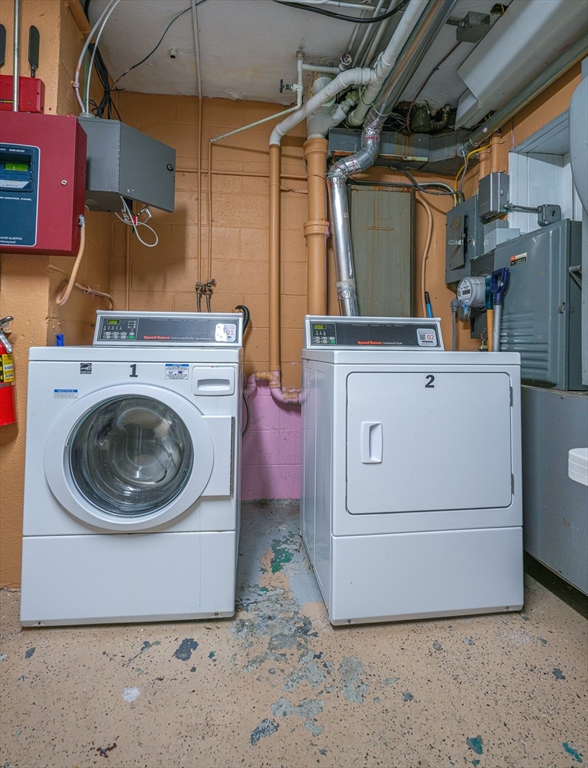 851 Broadway, Unit 21 Everett, MA 02149 - Photo 9 of 10 a utility room with dryer and washer
