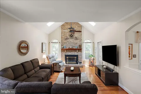a kitchen with kitchen island granite countertop wooden cabinets and stainless steel appliances