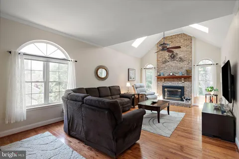 a large kitchen with lots of counter space and dining table
