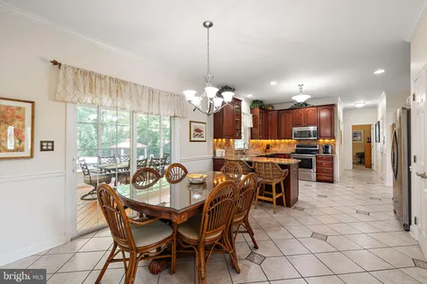 a view of a dining room and livingroom with furniture