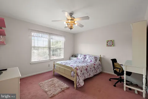 a view of a house with swimming pool and sitting area