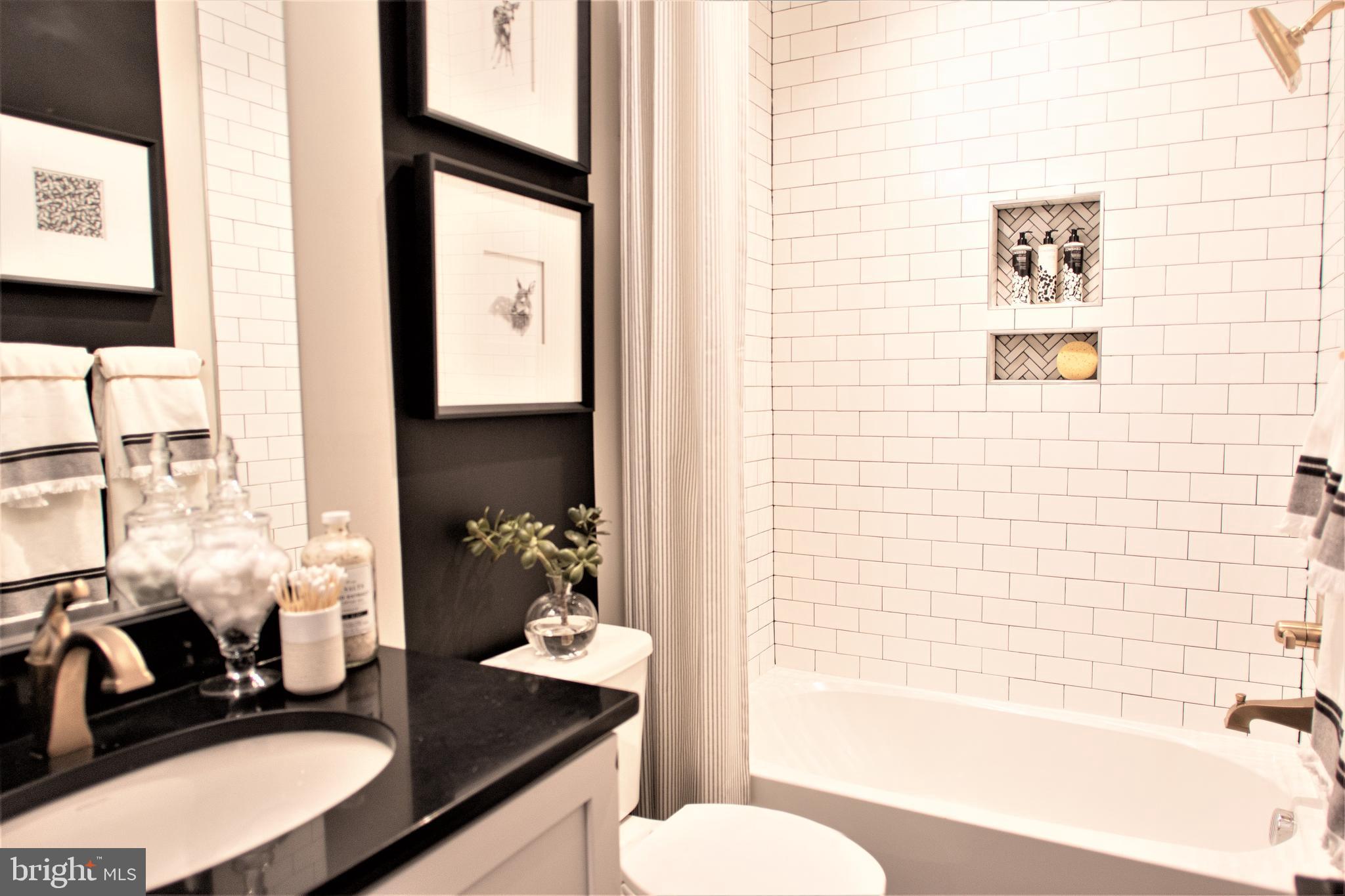 Tbb Highland Way, Unit INSPIRE Gettysburg, PA 17325 - Photo 30 of 46 a bathroom with a granite countertop sink toilet and shower