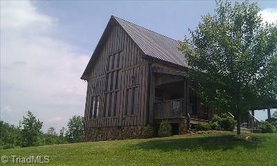 627 Mount Herman Church Road Mount Airy, NC 27030 - Photo 1 of 20 Whippoorwill Cabin built in 2006 beautifully situated on private 41 acres fenced with cattle in the distance