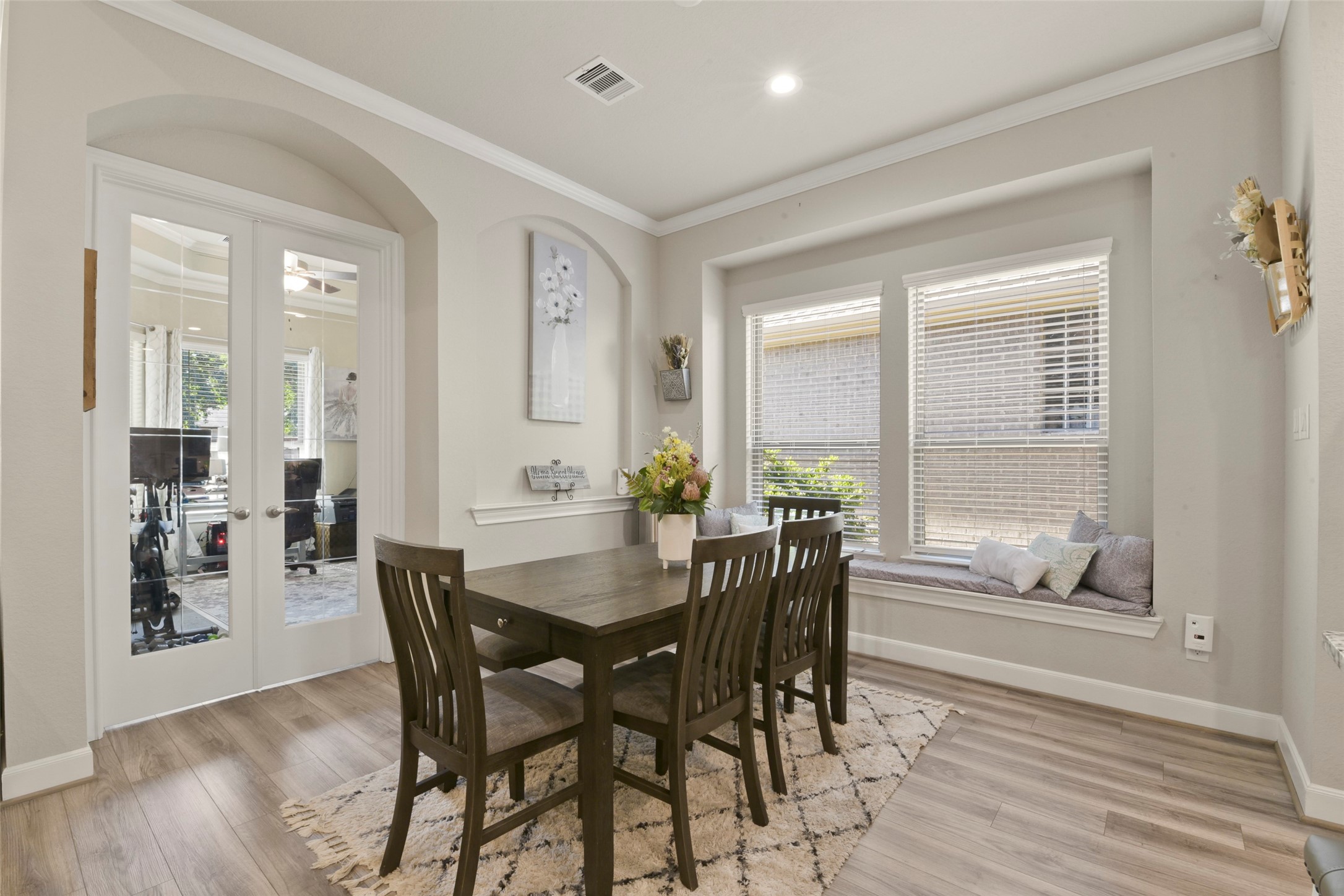 4582 Silver Moon Drive Spring, TX 77386 - Photo 16 of 48 a view of a dining room with furniture and wooden floor