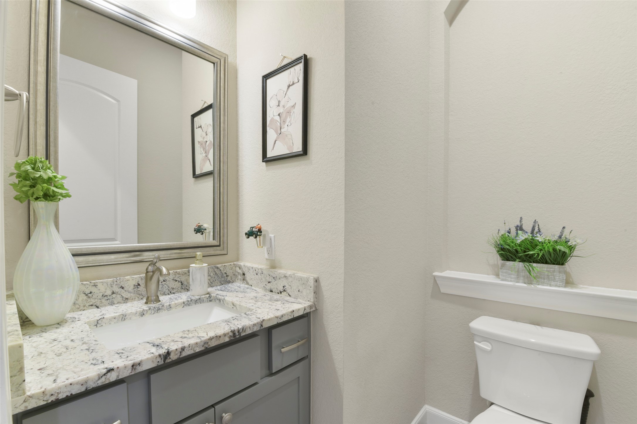 4582 Silver Moon Drive Spring, TX 77386 - Photo 20 of 48 a bathroom with a granite countertop sink and a mirror