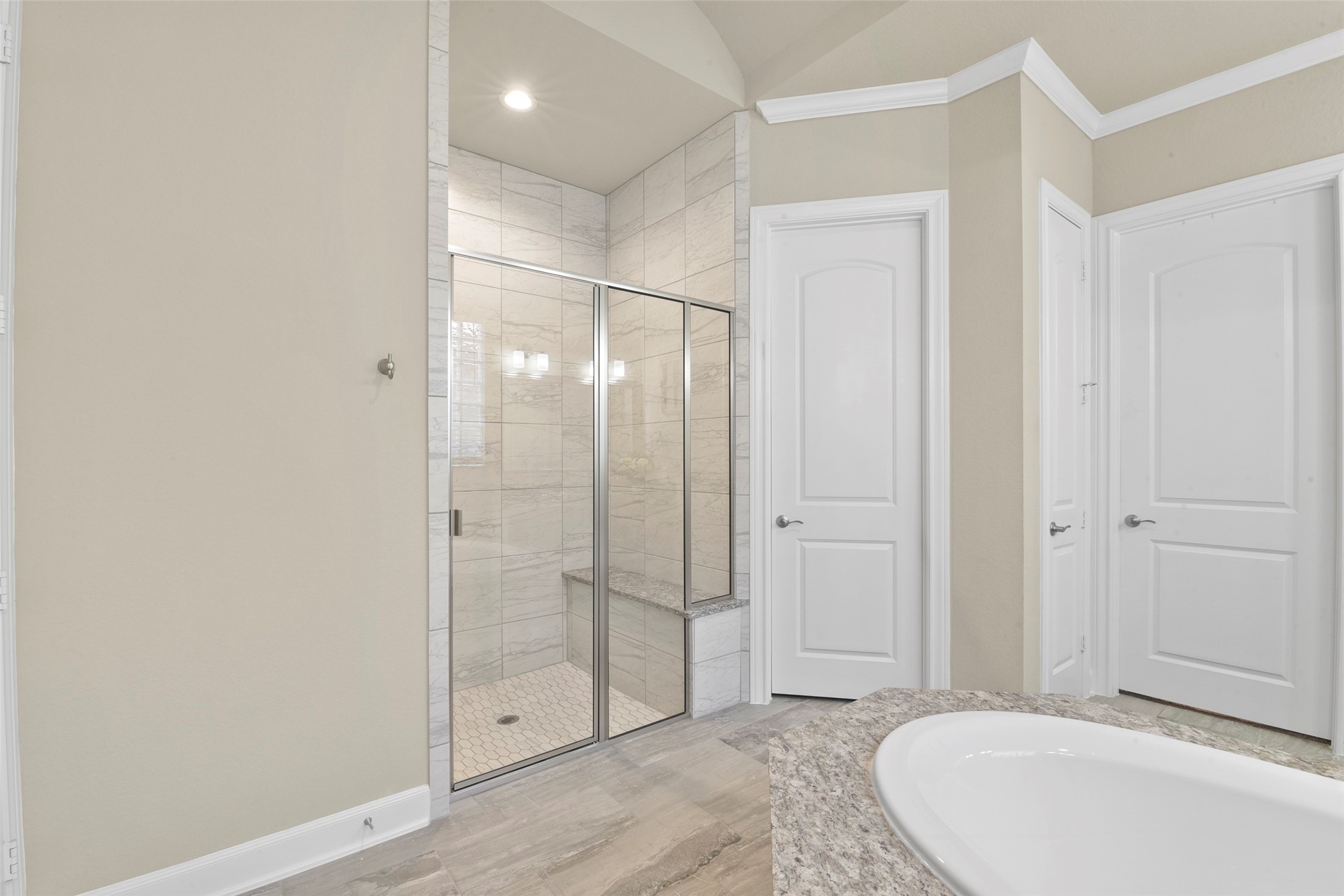 4582 Silver Moon Drive Spring, TX 77386 - Photo 28 of 48 a spacious bathroom with a glass shower door and a bathtub