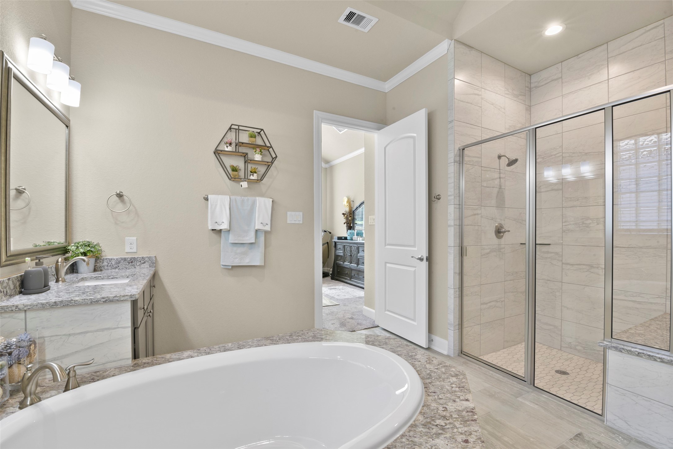 4582 Silver Moon Drive Spring, TX 77386 - Photo 30 of 48 a spacious bathroom with a tub sink and mirror
