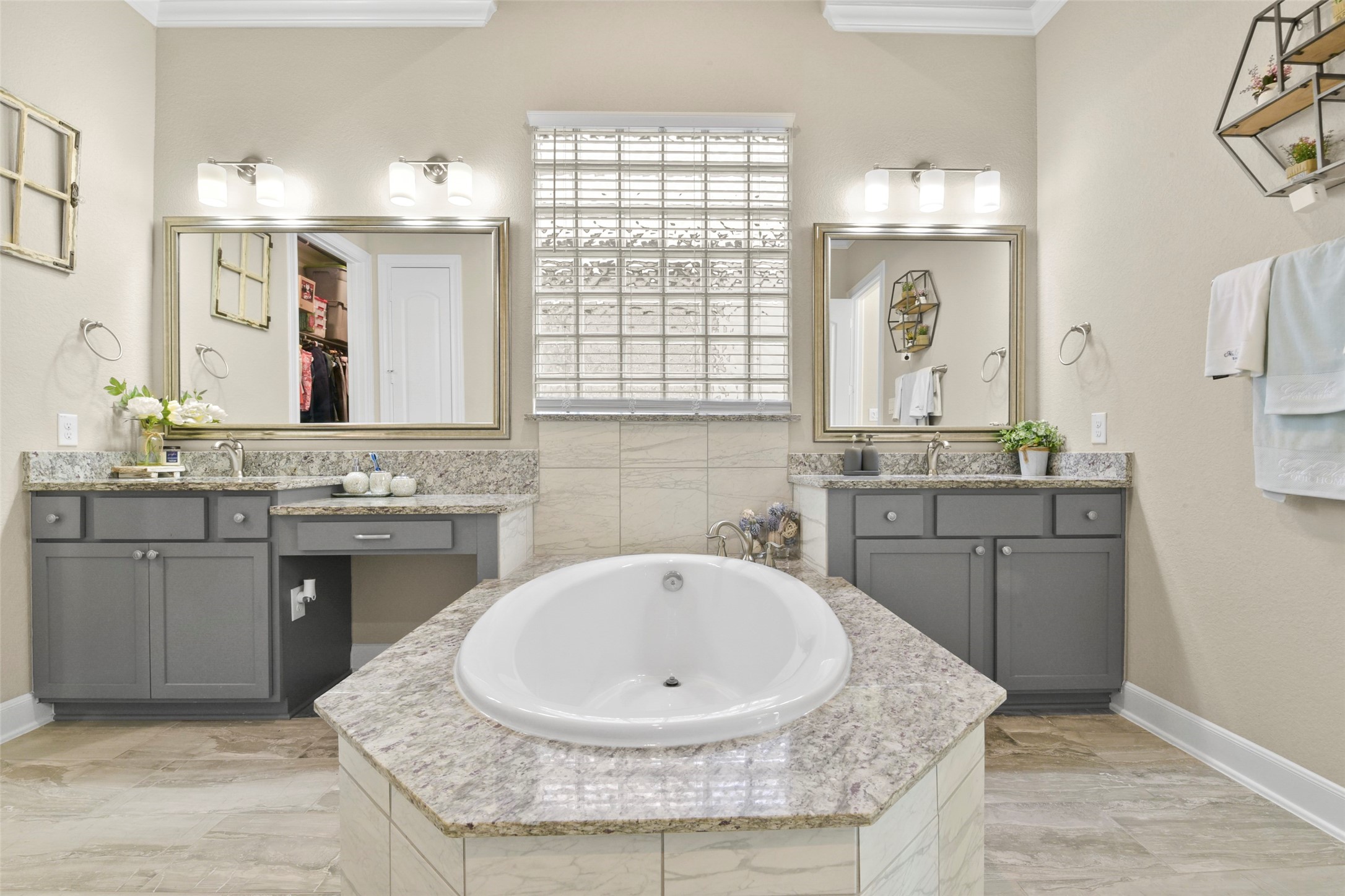 4582 Silver Moon Drive Spring, TX 77386 - Photo 31 of 48 a bathroom with a granite countertop sink a mirror and a bathtub