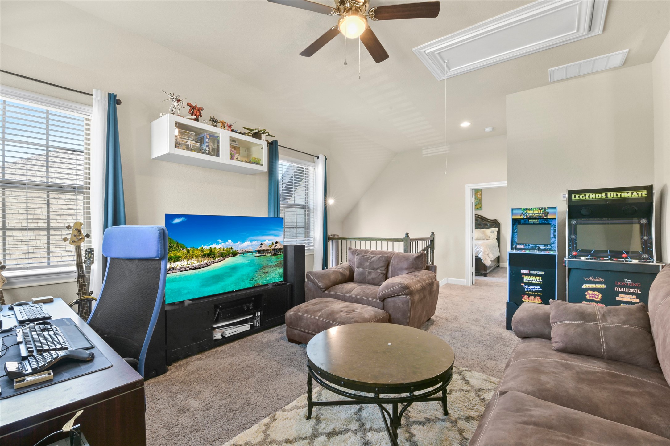 4582 Silver Moon Drive Spring, TX 77386 - Photo 34 of 48 a living room with furniture and a flat screen tv