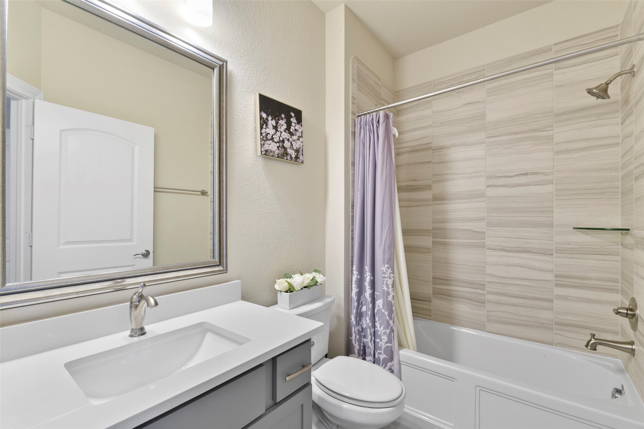 4582 Silver Moon Drive Spring, TX 77386 - Photo 38 of 48 a bathroom with a sink a toilet and shower