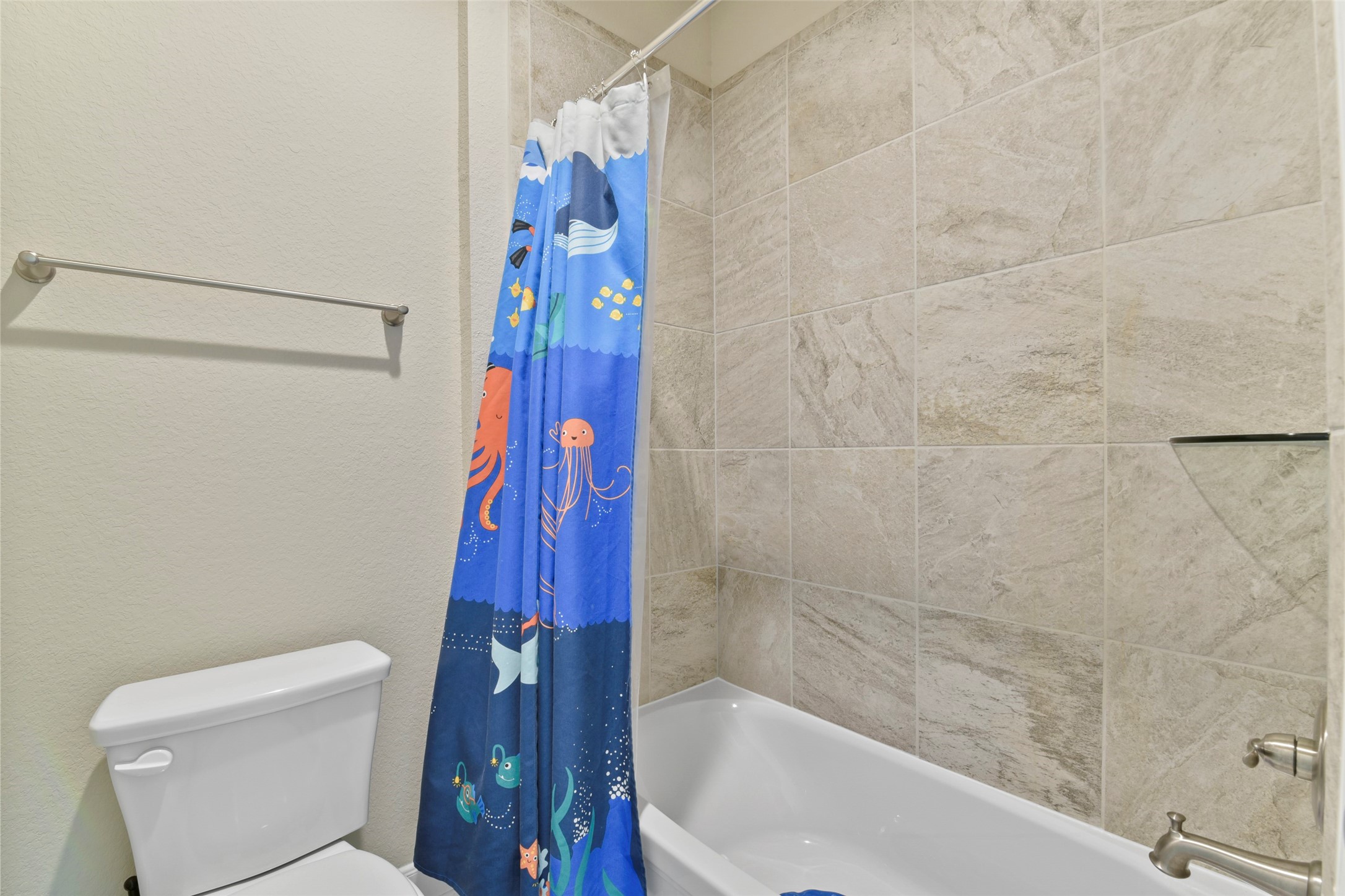 4582 Silver Moon Drive Spring, TX 77386 - Photo 42 of 48 a bathroom with a bathtub and shower