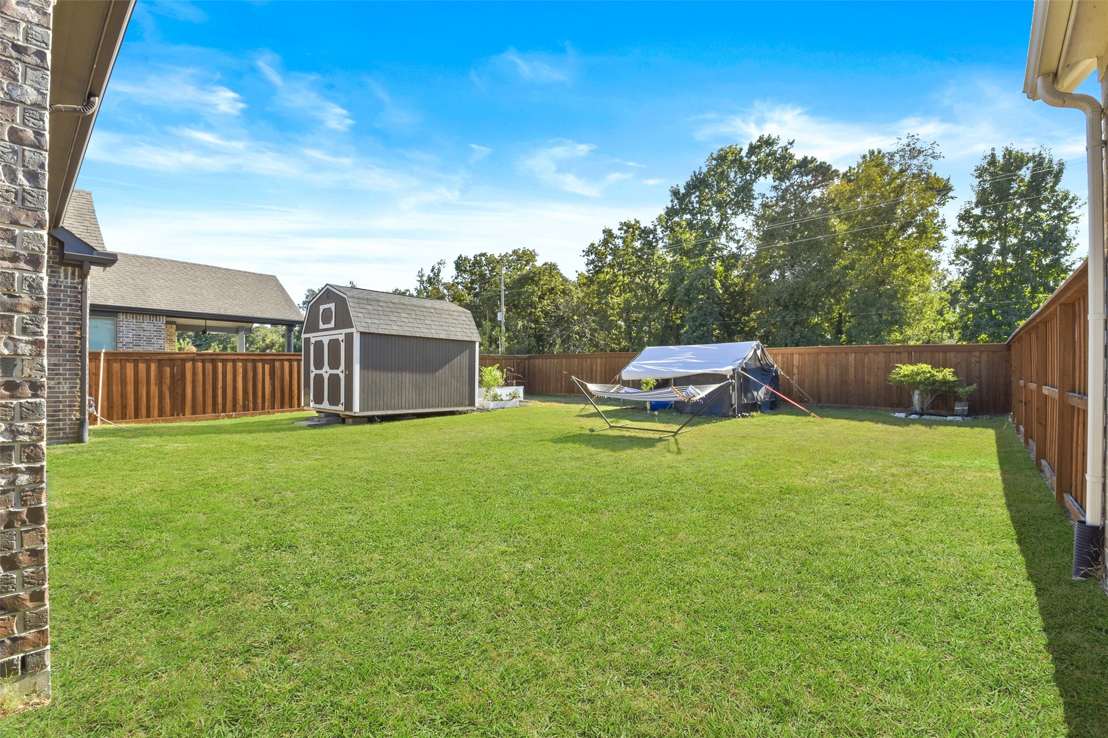 4582 Silver Moon Drive Spring, TX 77386 - Photo 46 of 48 a backyard of a house with lots of green space
