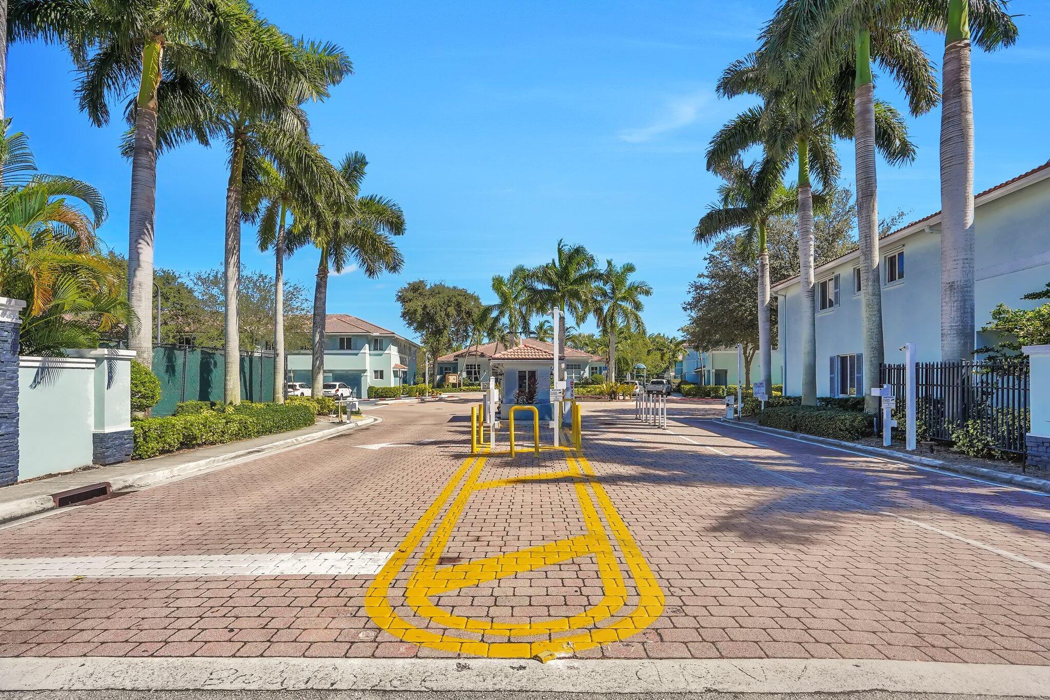 1969 Alamanda Way, Unit 1969 Riviera Beach, FL 33404 - Photo 25 of 26 a view of a swimming pool with palm trees