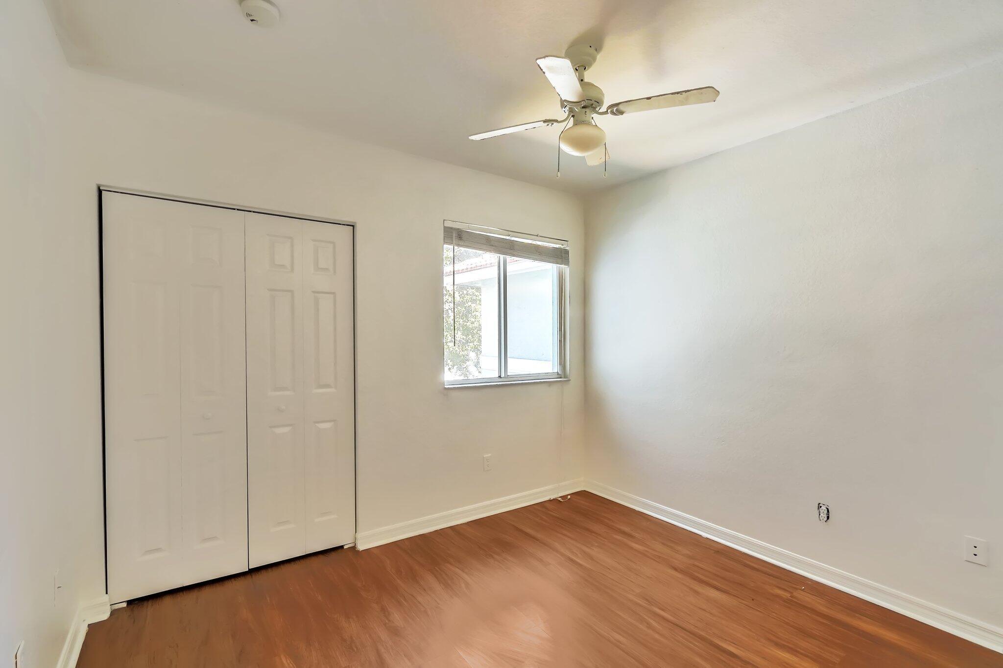 1969 Alamanda Way, Unit 1969 Riviera Beach, FL 33404 - Photo 8 of 26 a view of an empty room with a window