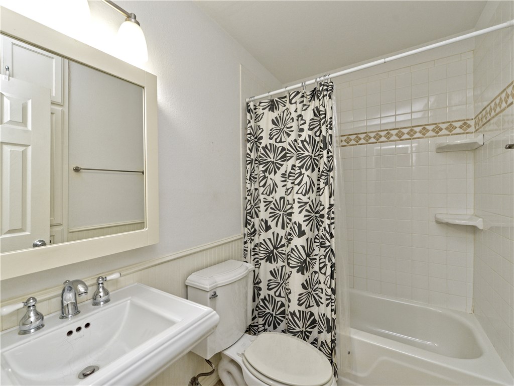 407 East 45th Street, Unit 210 Austin, TX 78751 - Photo 13 of 16 a bathroom with a sink toilet and shower