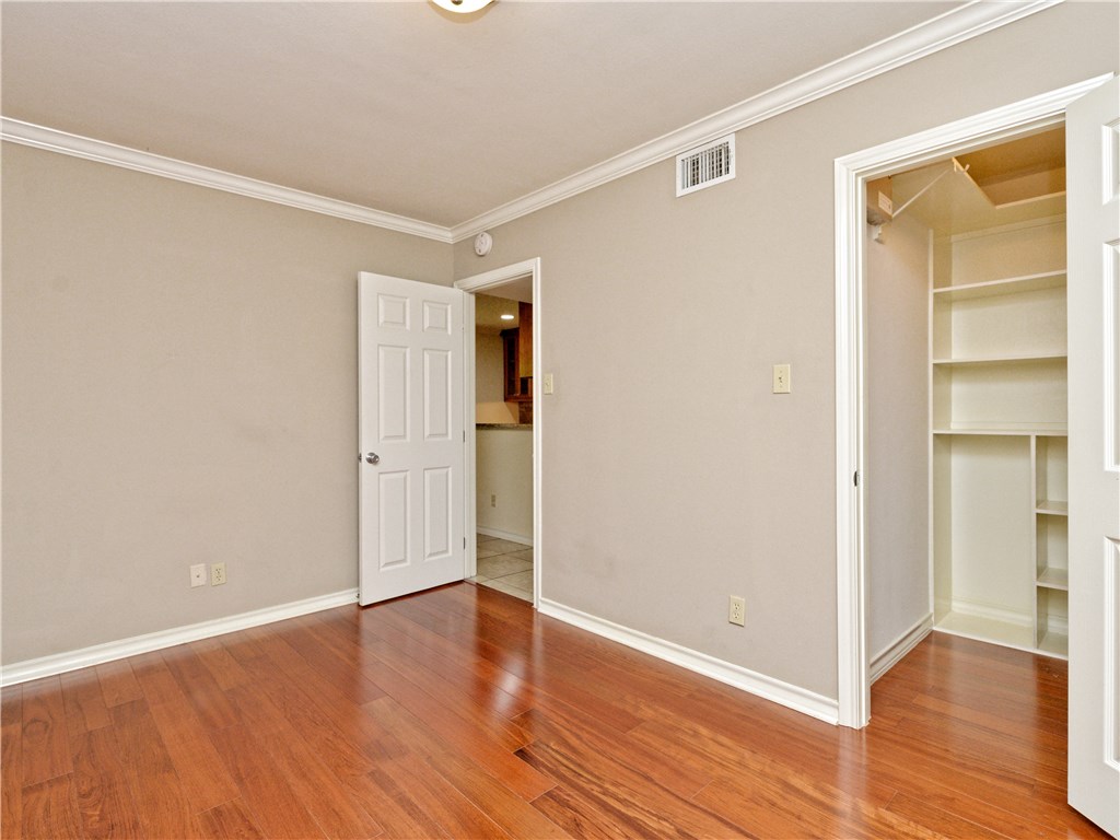 407 East 45th Street, Unit 210 Austin, TX 78751 - Photo 10 of 16 a view of an empty room with wooden floor