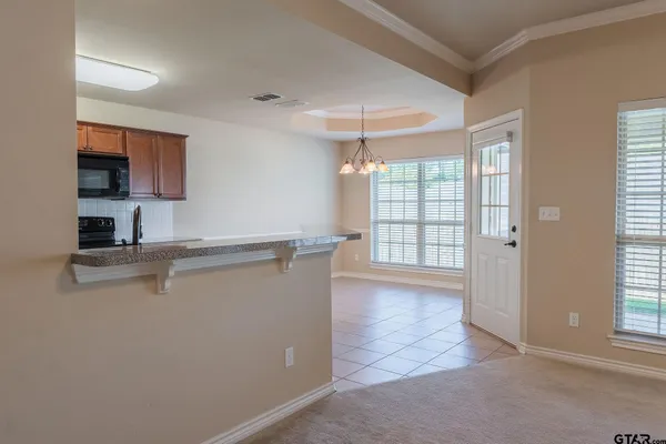 a view of a kitchen with a sink and a window
