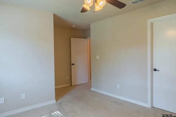 an empty room with a bathroom