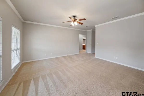 a view of an empty room with a window