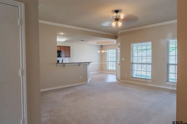 a view of an empty room with a window