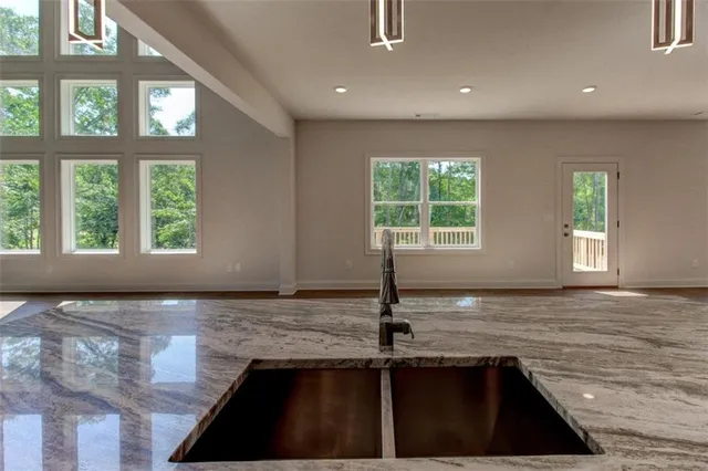 a view of a kitchen with a sink and window