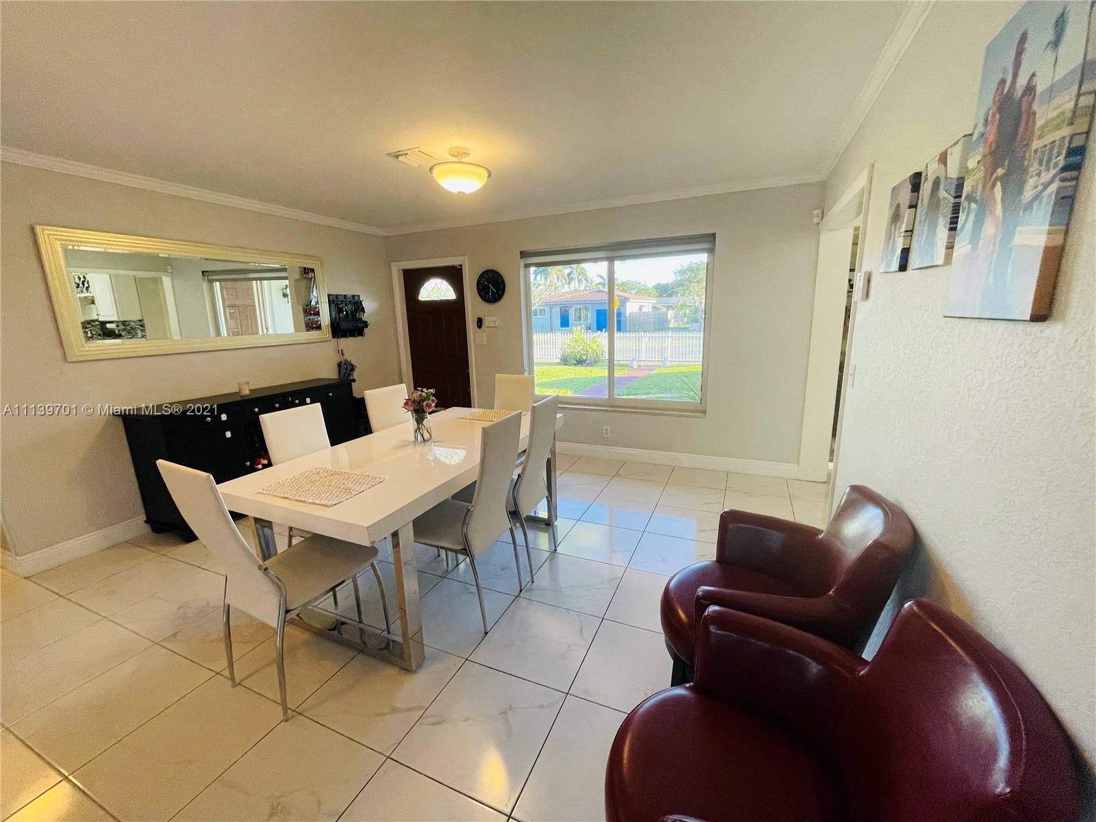 211 Southeast 3rd Street Dania Beach, FL 33004 - Photo 14 of 21 a view of a livingroom with furniture and window