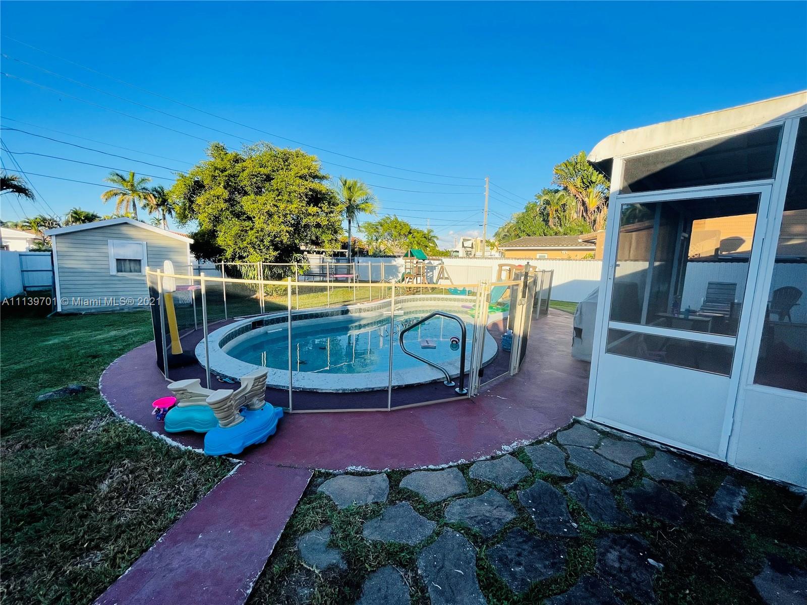 211 Southeast 3rd Street Dania Beach, FL 33004 - Photo 19 of 21 a view of a backyard with sitting area
