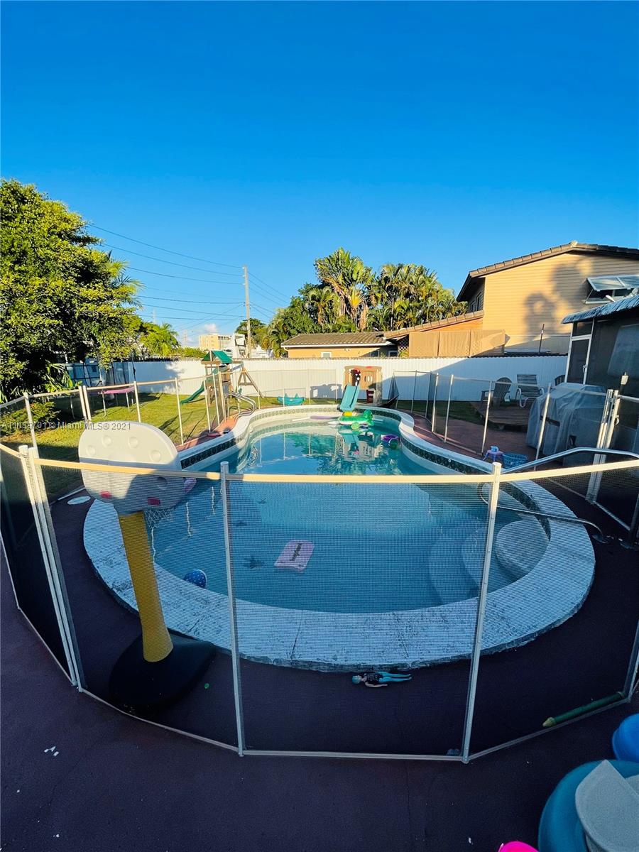 211 Southeast 3rd Street Dania Beach, FL 33004 - Photo 21 of 21 a view of a chairs and table in the patio