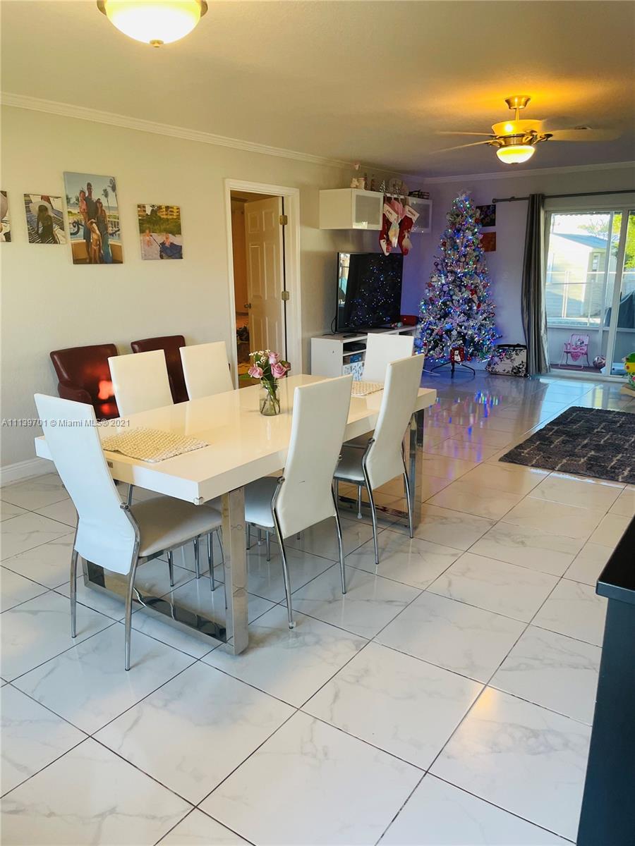 211 Southeast 3rd Street Dania Beach, FL 33004 - Photo 4 of 21 a view of a dining room with furniture