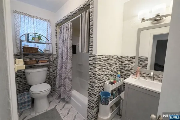 a bathroom with a toilet and a sink